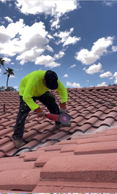 Las Vegas roofer fixing roof tiles on a residential home