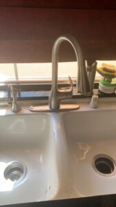 Kitchen faucet installation with double sink completed by a professional handyman in Las Vegas