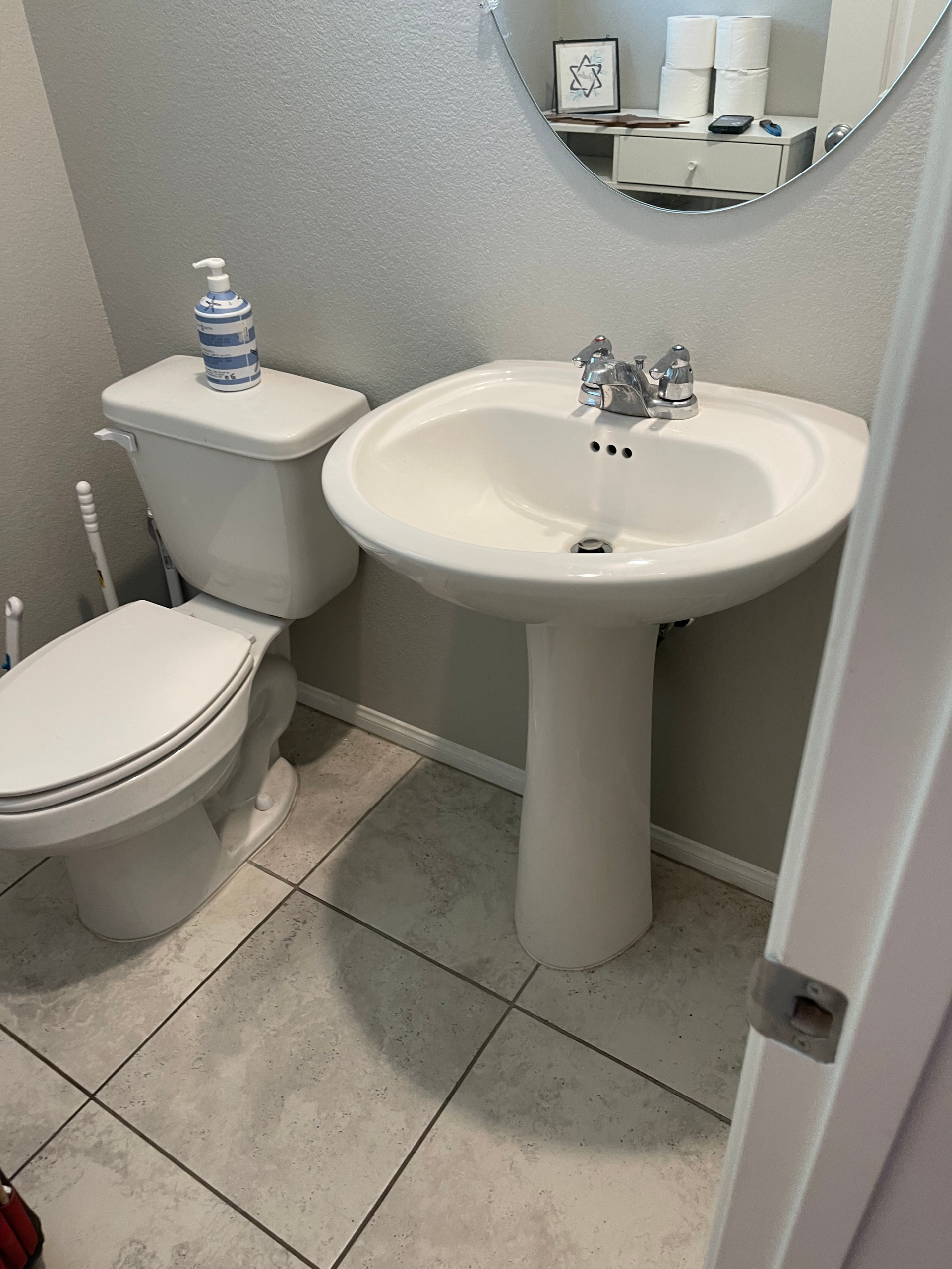 Bathroom pedestal sink before vanity replacement in Las Vegas