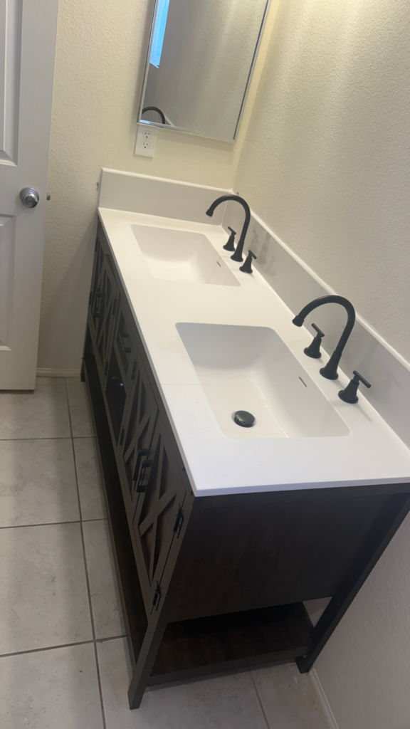 Side view of installed double-sink bathroom vanity with quartz top in Las Vegas