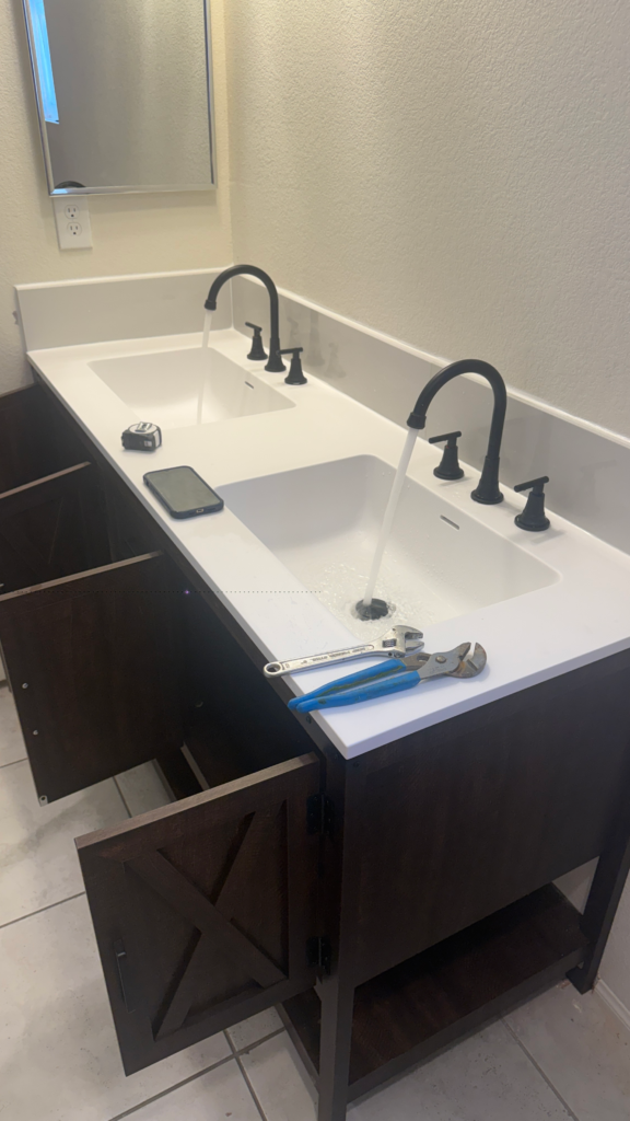 Testing two faucets and adjusting double vanity cabinet after installation