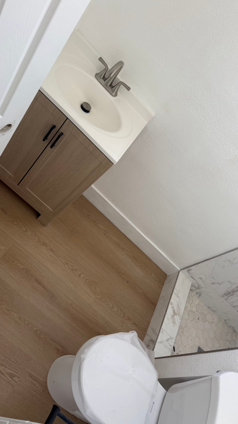 Bathroom vanity and shower threshold during the Las Vegas home restoration project.