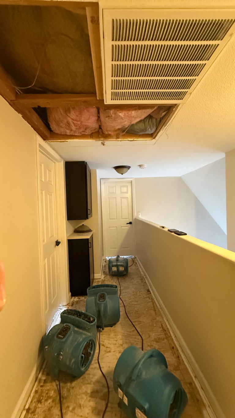 Ceiling vent and exposed insulation during drying during the Las Vegas home restoration project.