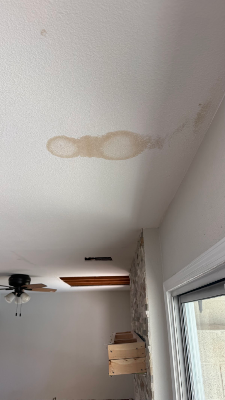 Ceiling water stains in kitchen and living area during the Las Vegas home restoration project.