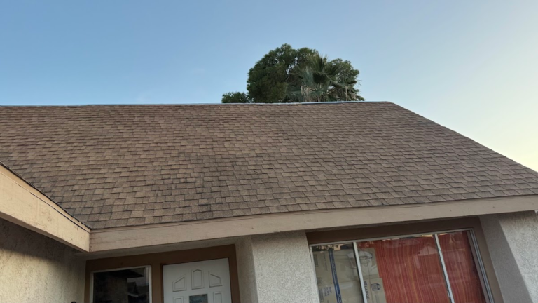 Completed shingle roof above front entry during the Las Vegas home restoration project.