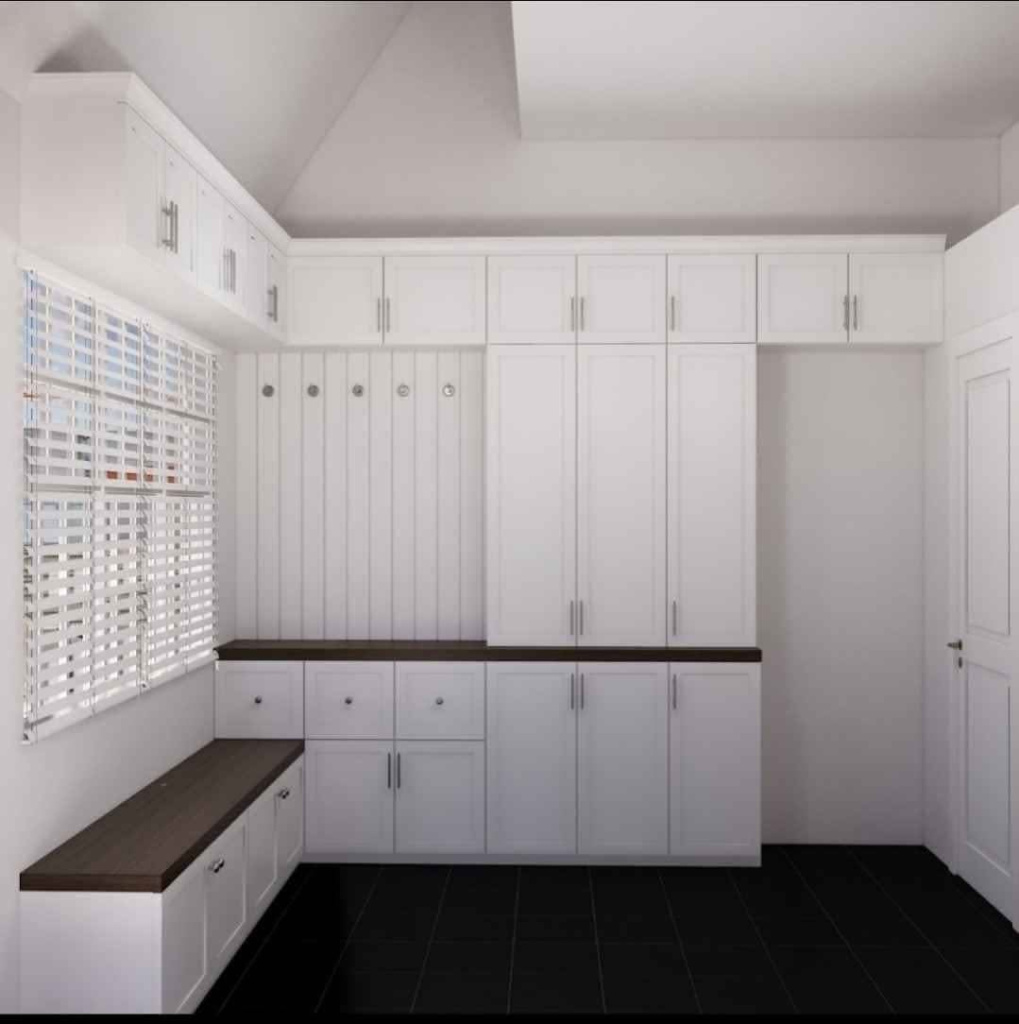 Custom white built-in cabinets with bench seating and wood countertop