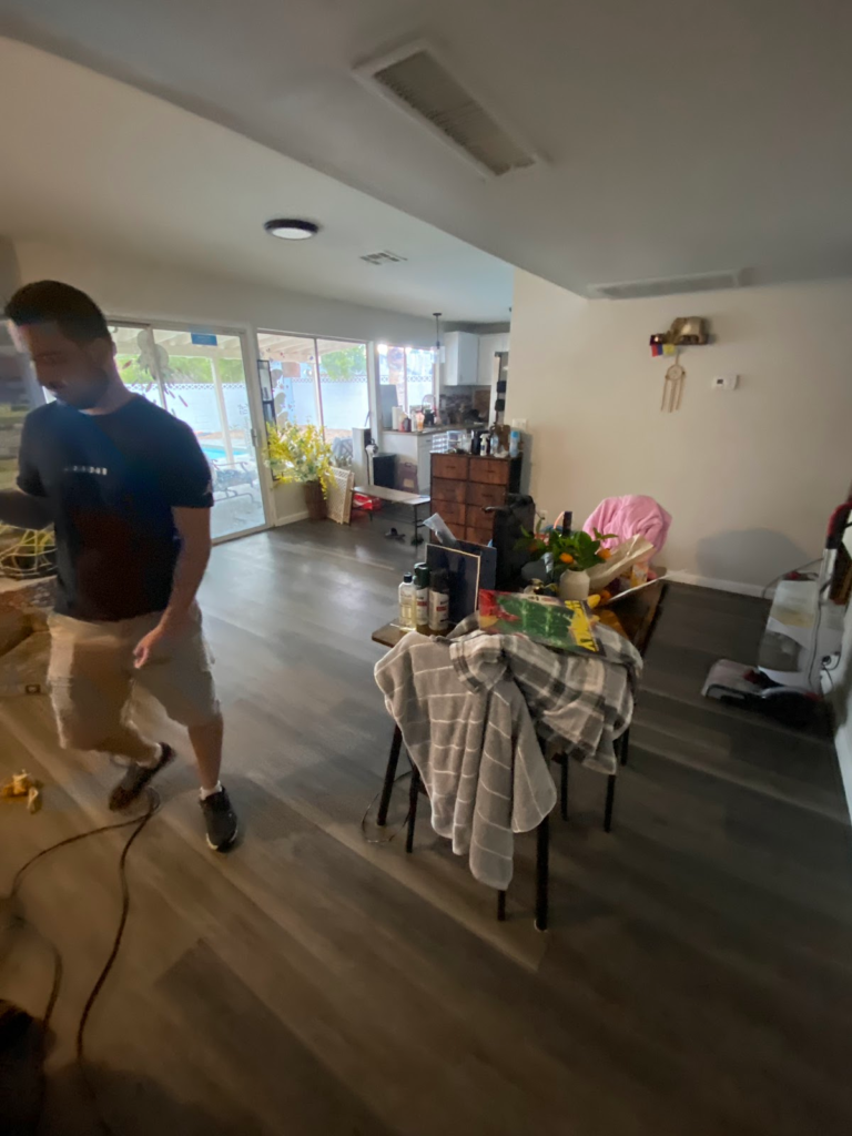 Dining area and kitchen before restoration during the Las Vegas home restoration project.