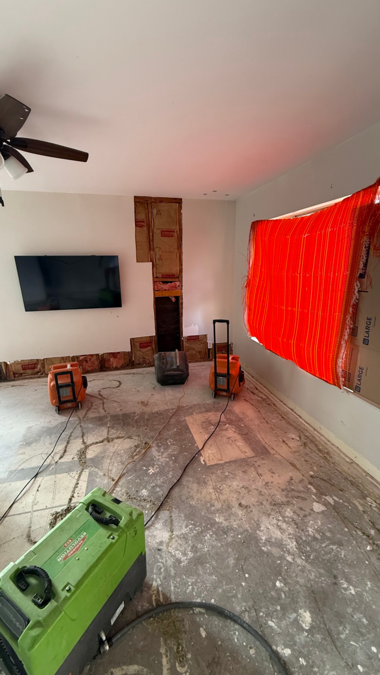 Drying equipment beneath ceiling fan during the Las Vegas home restoration project.