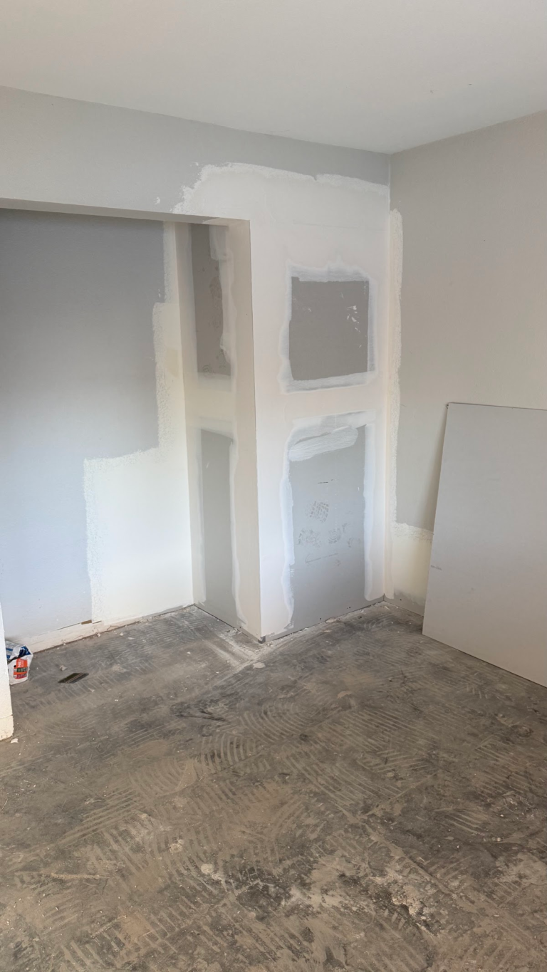 Drywall finishing around interior closet during the Las Vegas home restoration project.