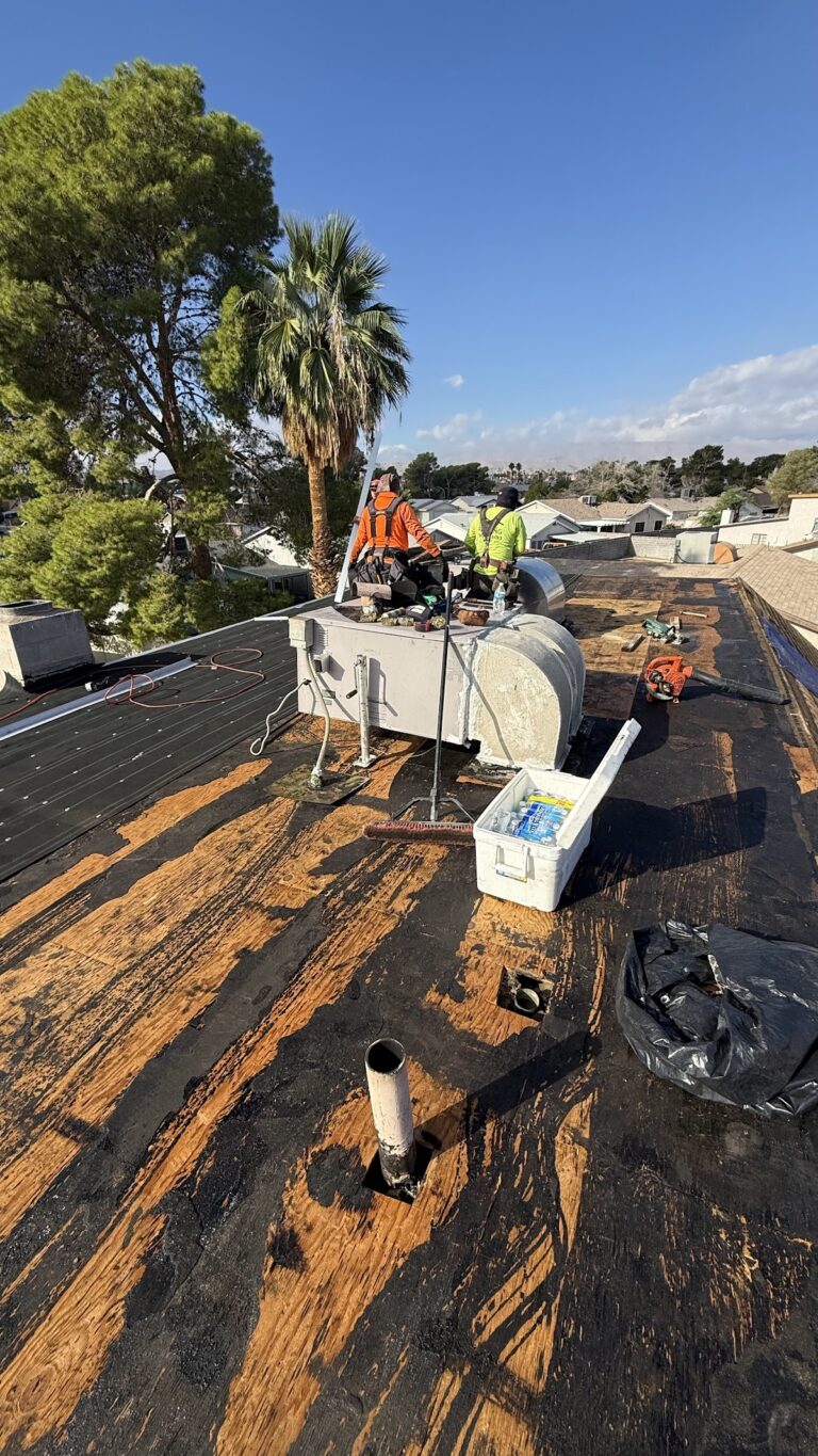 Exposed roof decking around HVAC during tear-off during the Las Vegas home restoration project.