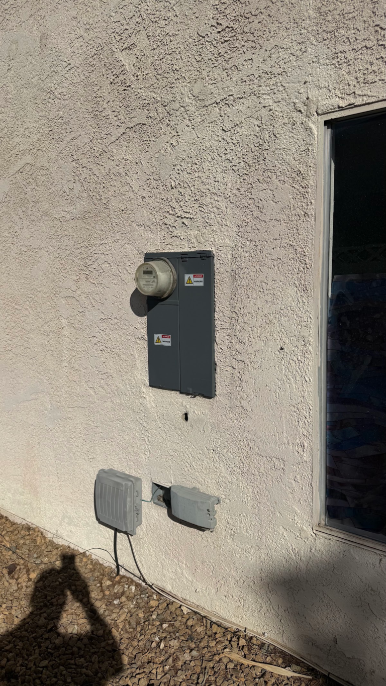 Exterior electrical panel and utility boxes during the Las Vegas home restoration project.