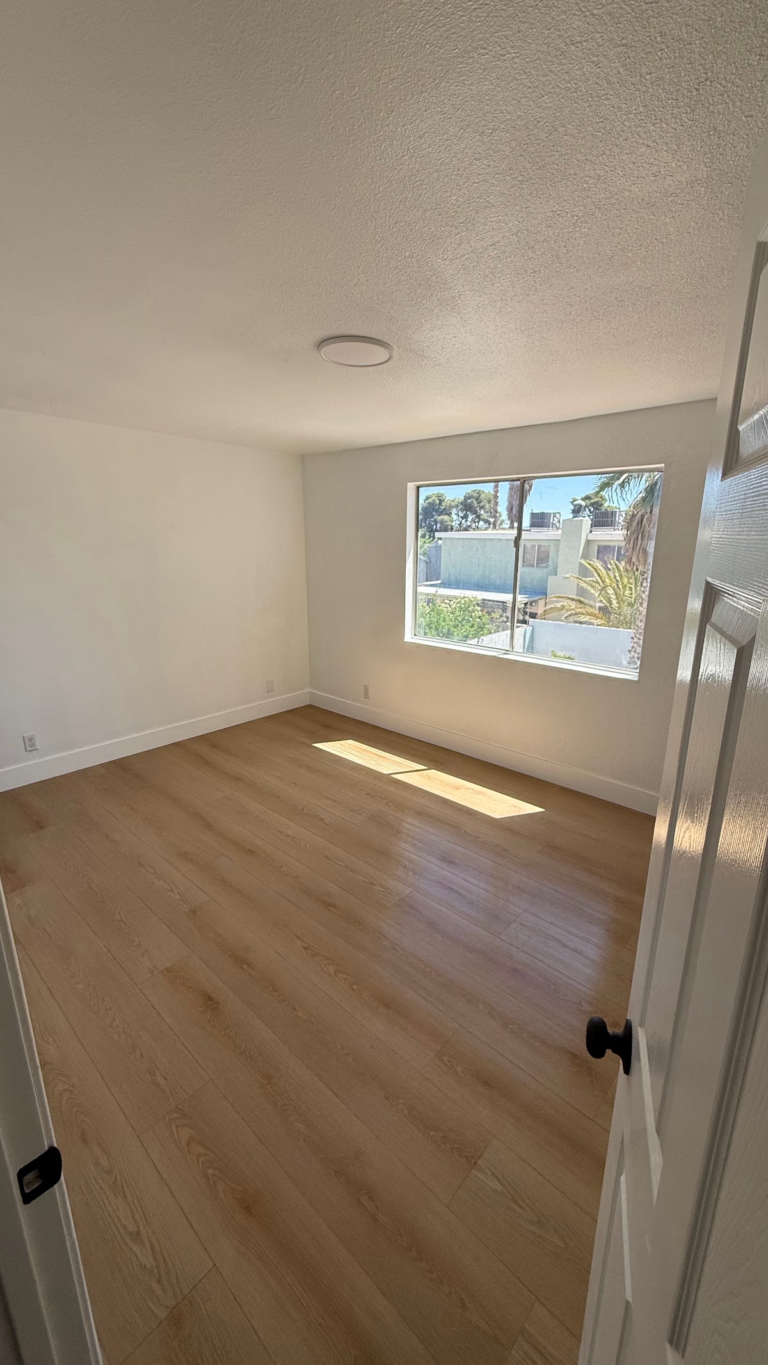 Finished bedroom doorway and window during the Las Vegas home restoration project.