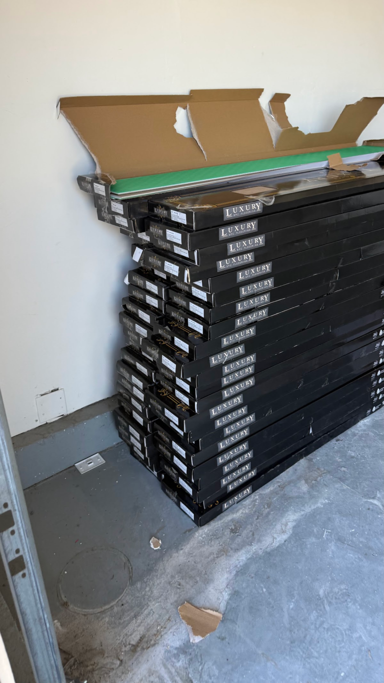 Flooring cartons staged indoors during the Las Vegas home restoration project.