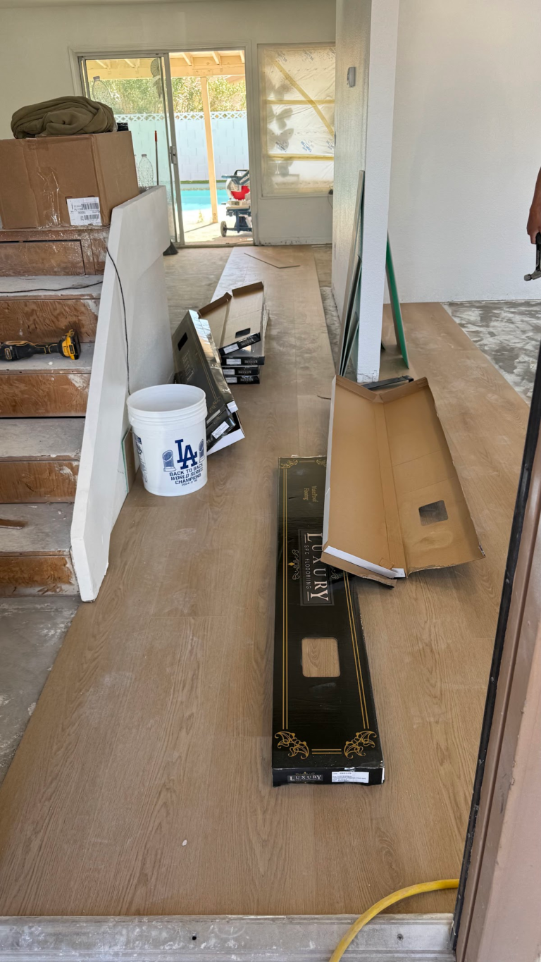 Flooring planks and tools in progress during the Las Vegas home restoration project.