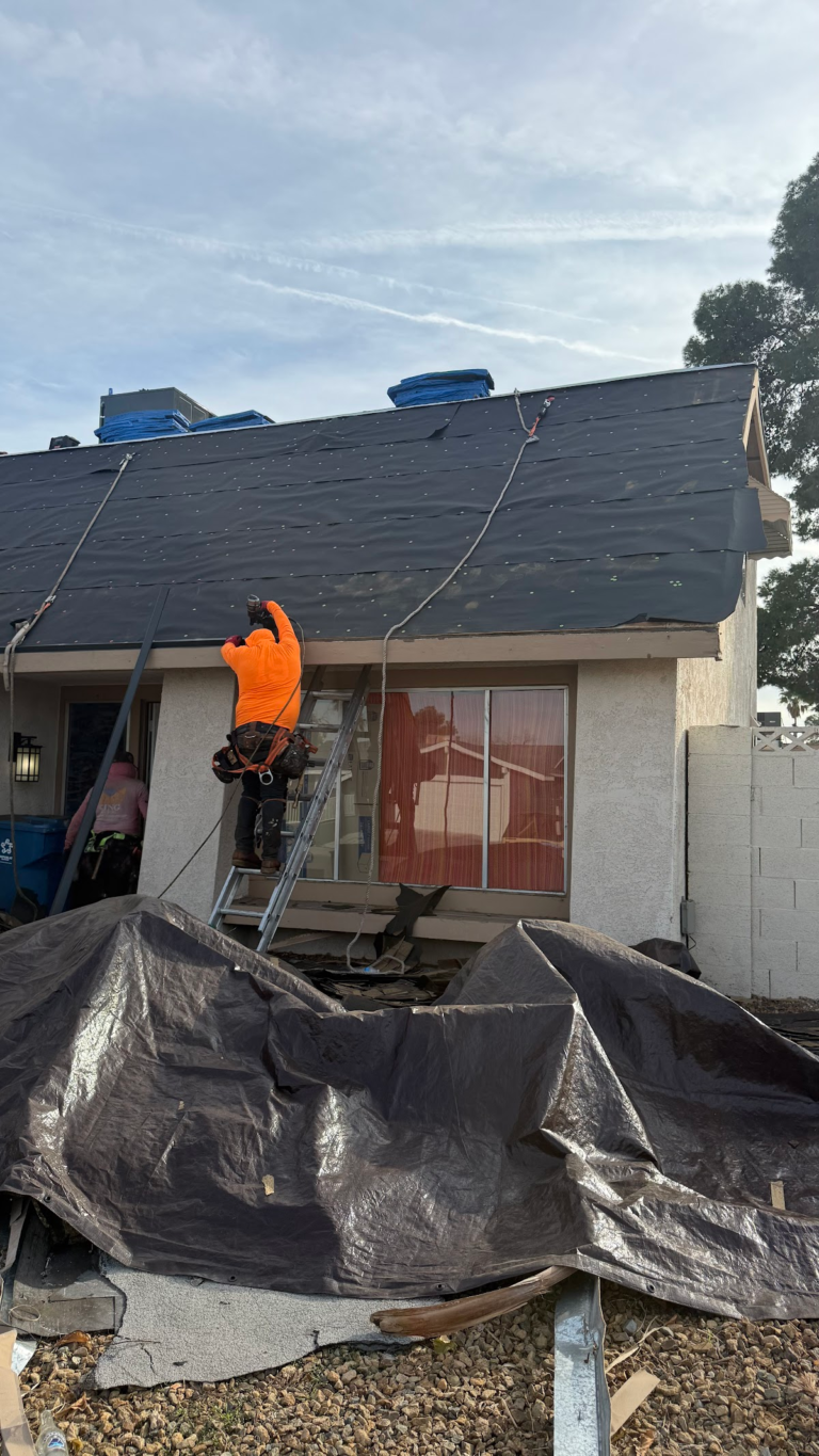 Front entry roof replacement with debris protection during the Las Vegas home restoration project.