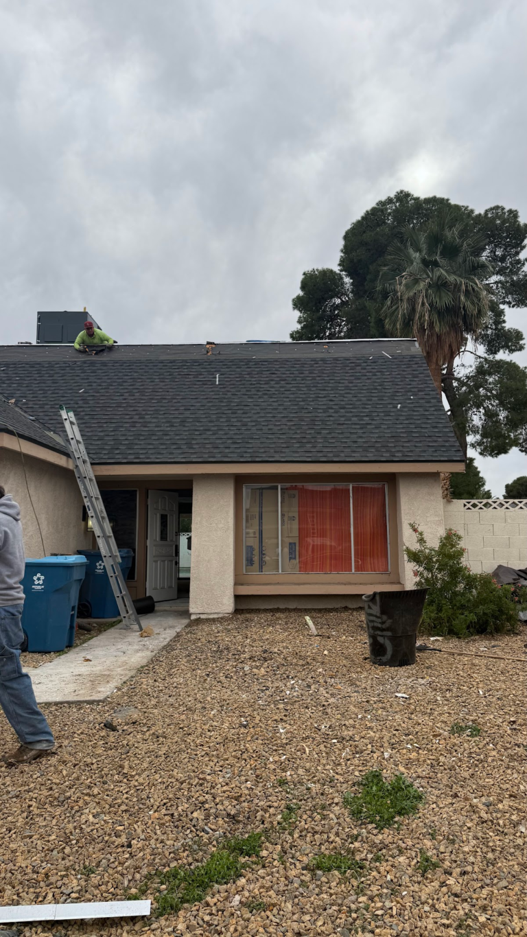 Front exterior during roof restoration during the Las Vegas home restoration project.