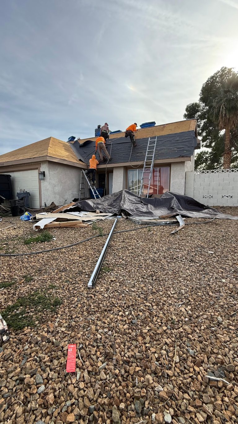 Front yard view of roof replacement during the Las Vegas home restoration project.