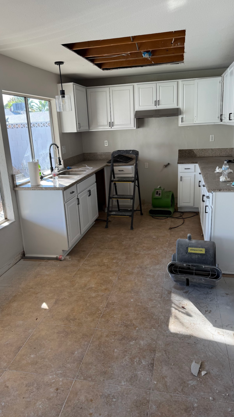 Kitchen renovation with ceiling access opening during the Las Vegas home restoration project.