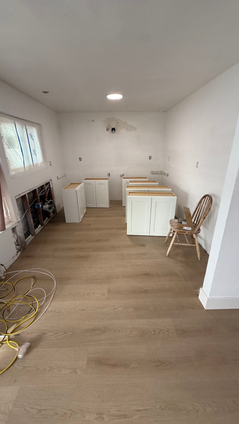 Kitchen renovation with flooring installed during the Las Vegas home restoration project.