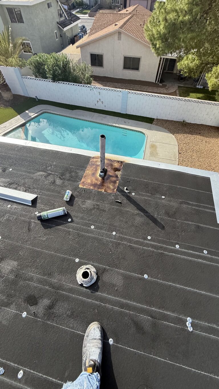 Roof edge flashing and ventilation pipe during the Las Vegas home restoration project.