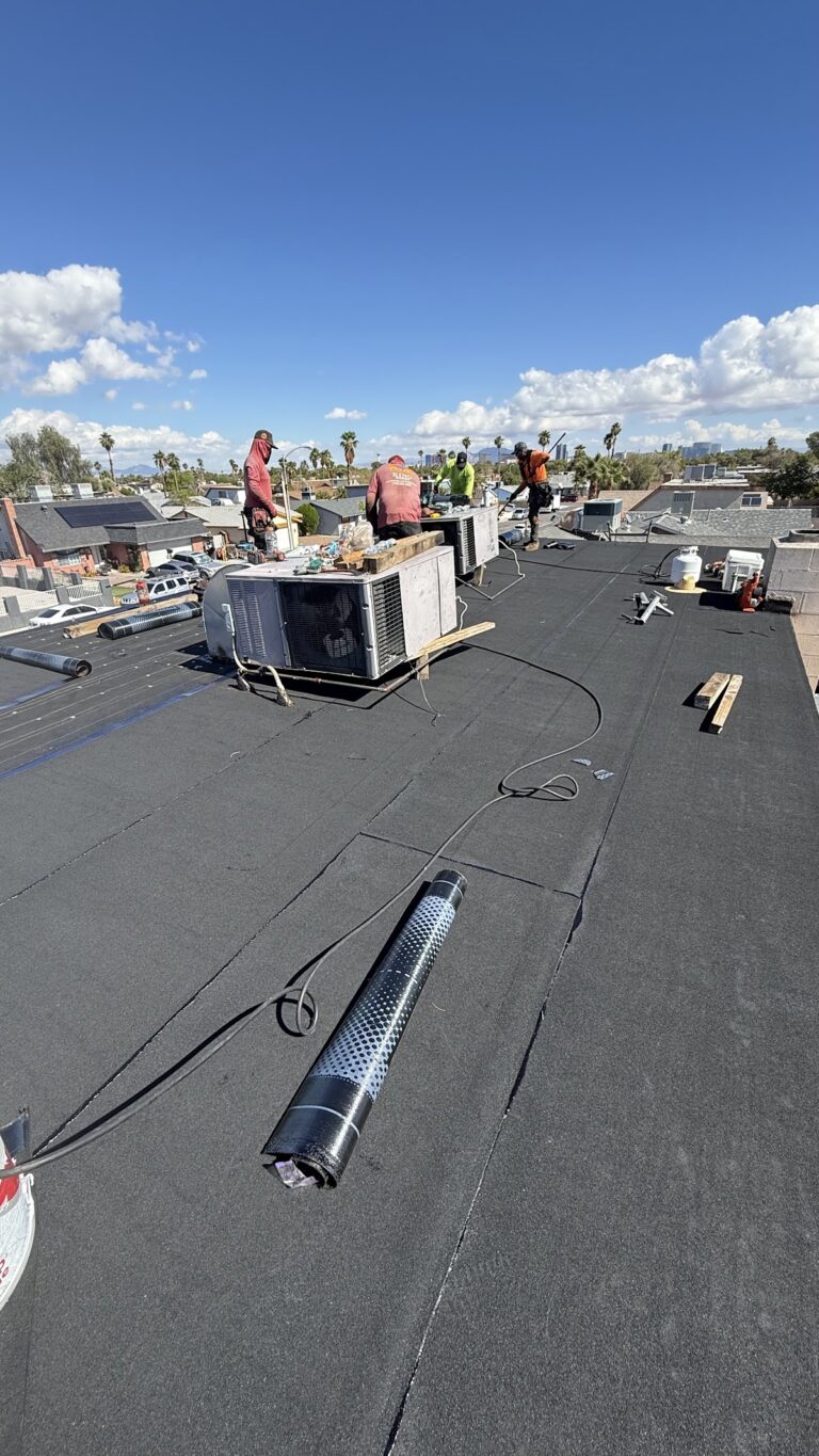 Roof restoration around rooftop HVAC unit during the Las Vegas home restoration project.