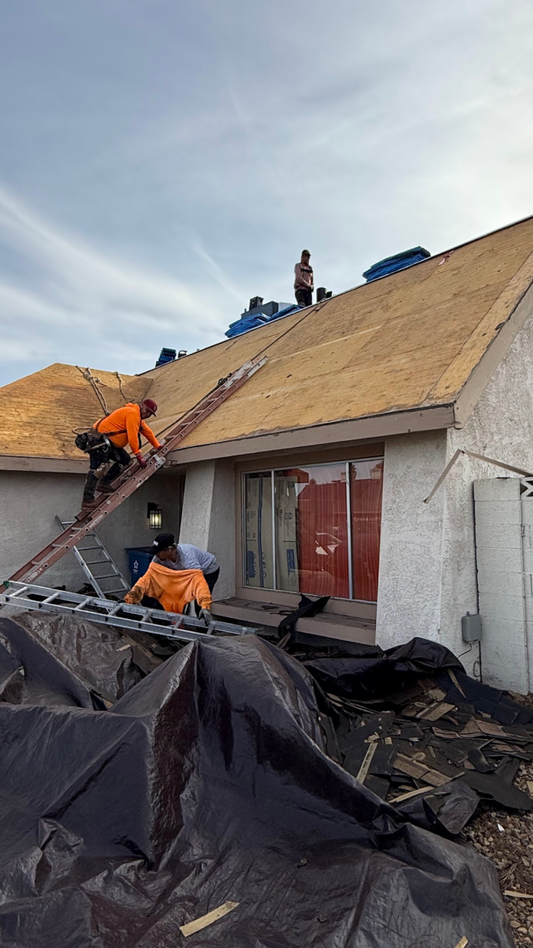 Roof tear-off exposing wood decking during the Las Vegas home restoration project.