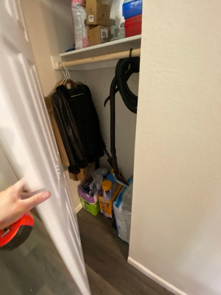 Utility closet inspection during the Las Vegas home restoration project.